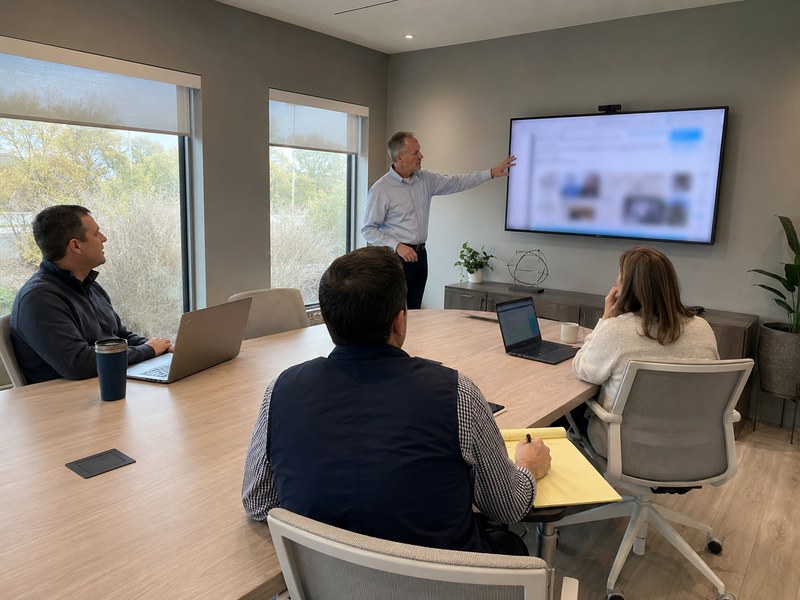 An operator&rsquo;s team being trained on their new facilities work-order system in a conference room